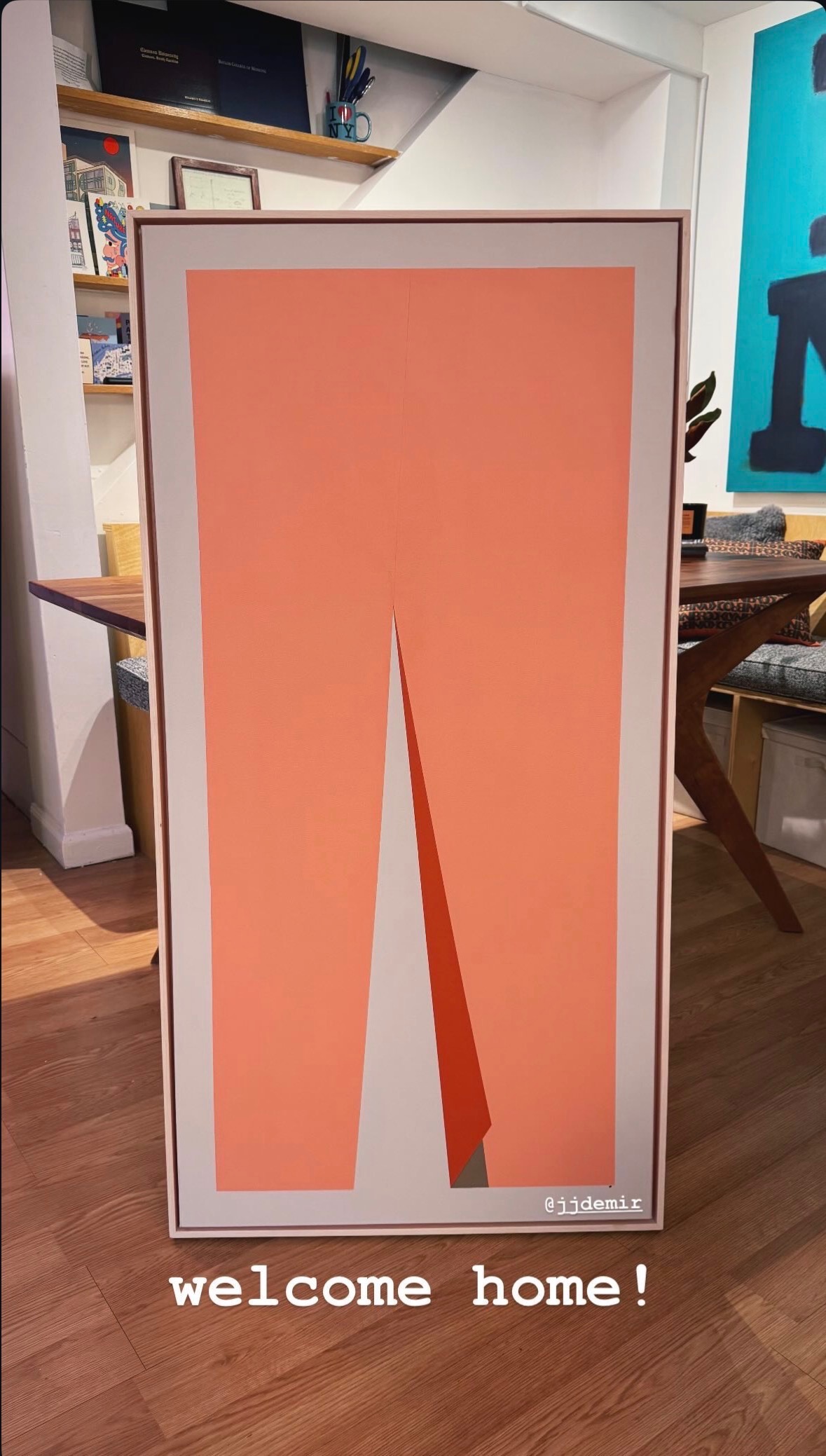 Tall coral geometric artwork in a home